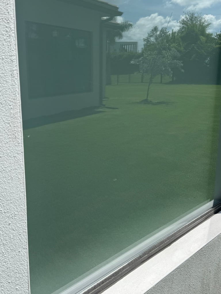 Same glass completely clear after hard water stain removal by HappyPane Solutions